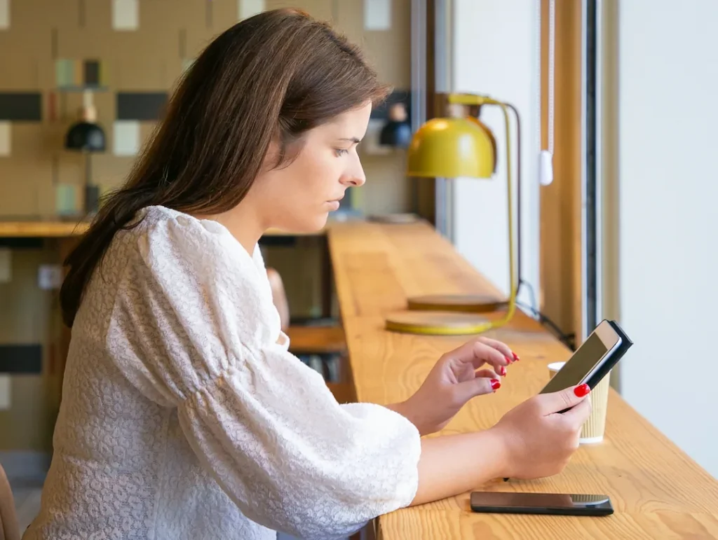 Focused Female Manager Using Tablet While Sitting Desk Co Working Space Coffee Shop 1
